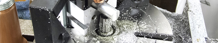 Machined metal on a mill in a fixture - Prototype process selection